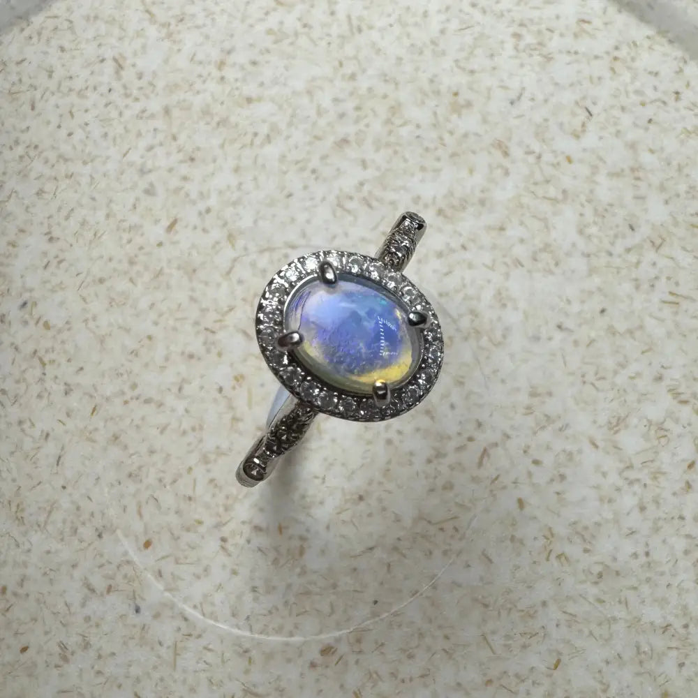 Oval moonstone ring with diamond halo from Wave Rock Grace handcrafted sterling silver