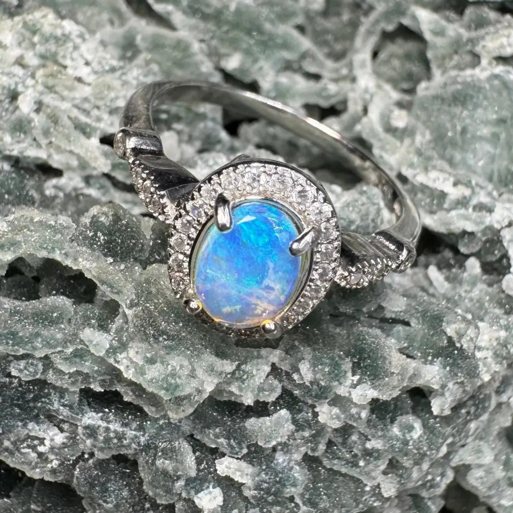 Silver ring with 0.8ct Lightning Ridge Opal and diamond halo in sterling silver size N