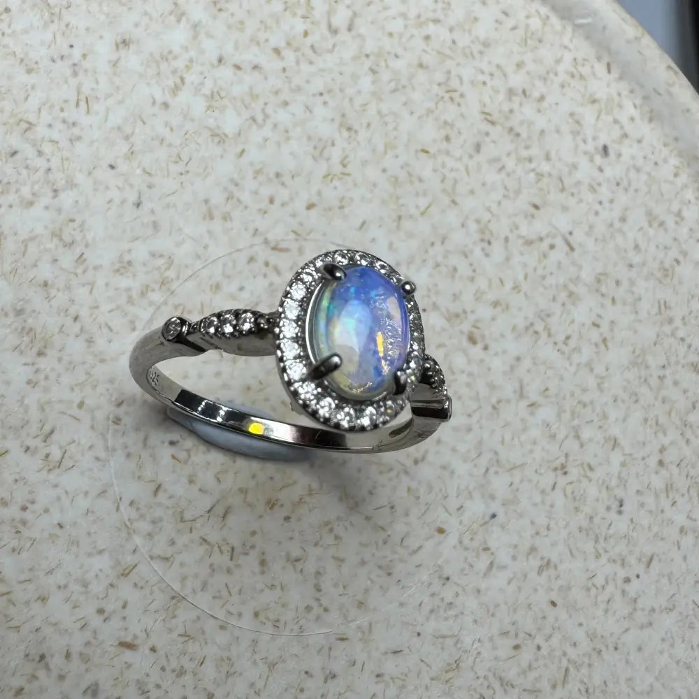 Silver ring with oval Lightning Ridge Opal and diamond halo in 925 Sterling Silver