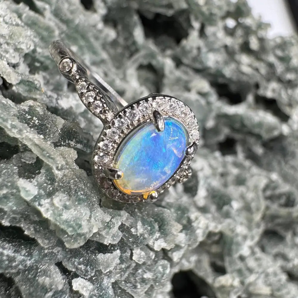 Handcrafted Wave Rock Grace ring featuring a 0.8ct Lightning Ridge Opal with diamond halo in sterling silver