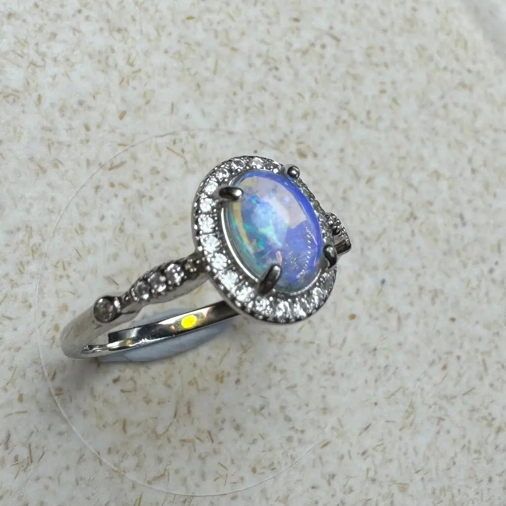 Opal halo ring from Wave Rock Grace with 0.8ct Lightning Ridge Opal and Cubic Zirconia