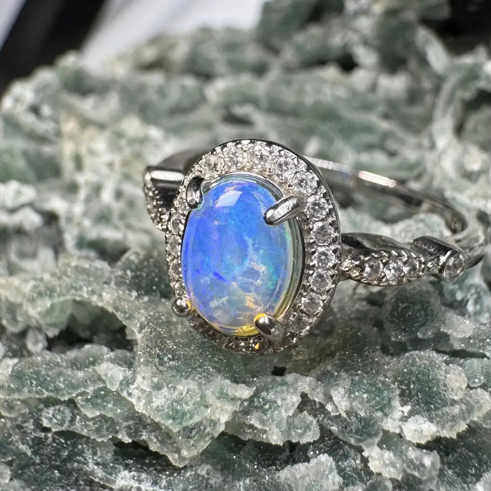Opal ring with diamond halo from Wave Rock Grace featuring Lightning Ridge Opal and CZ on silver