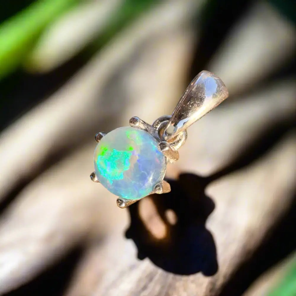 Round opal pendant from Whale’s Journey with a 1ct Lightning Ridge Crystal Opal in sterling silver