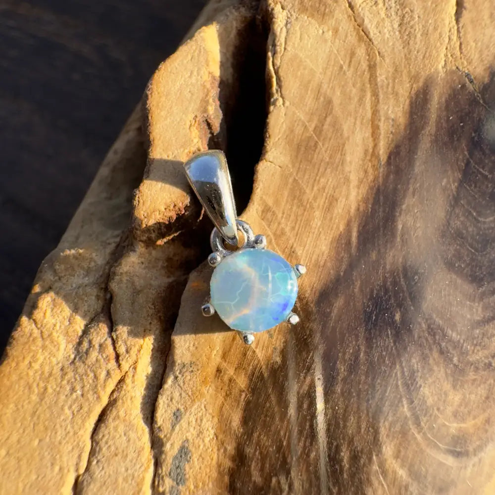 Silver pendant featuring iridescent Lightning Ridge Crystal Opal in a handcrafted design