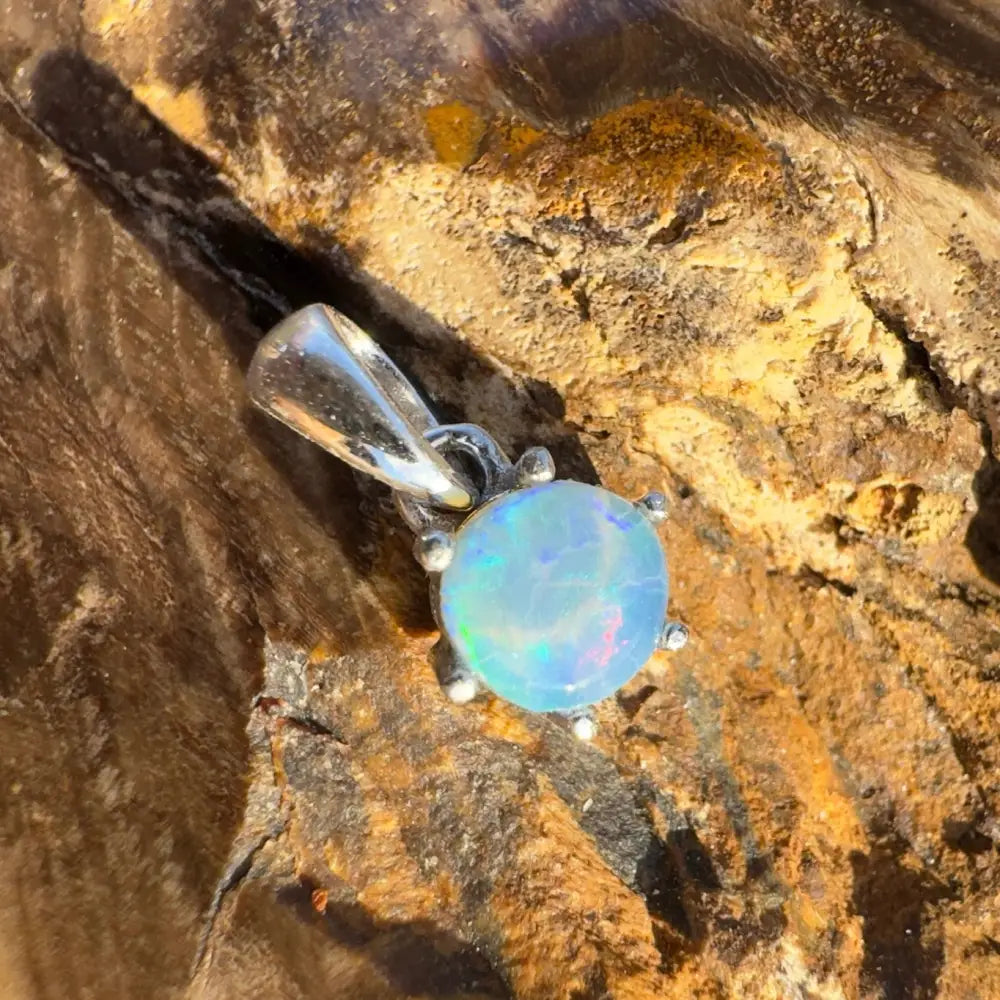Opal pendant with silver setting from Whale’s Journey handcrafted Lightning Ridge Crystal collection