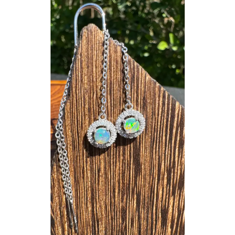 Silver opal halo earrings from Whitsunday Sparkle featuring 0.7ct Lightning Ridge Opal and Cubic Zirconia