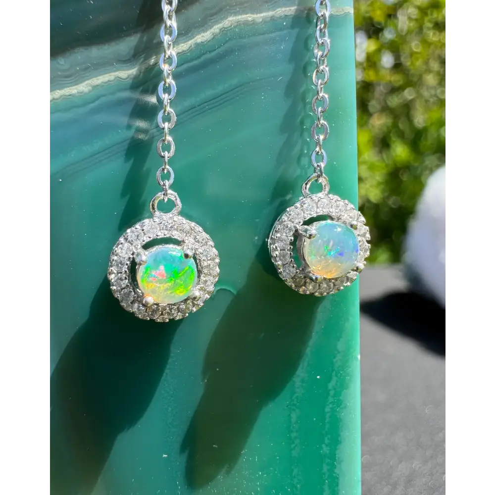 Handcrafted Whitsunday Sparkle earrings featuring 0.7ct Lightning Ridge Opal and diamond halo design