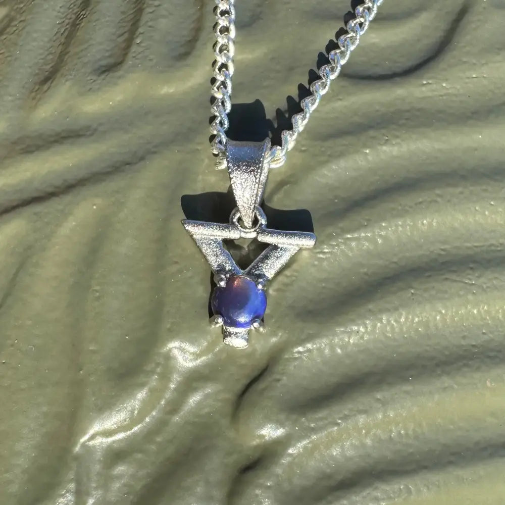 Silver pendant necklace with a radiant blue Lightning Ridge Opal gemstone