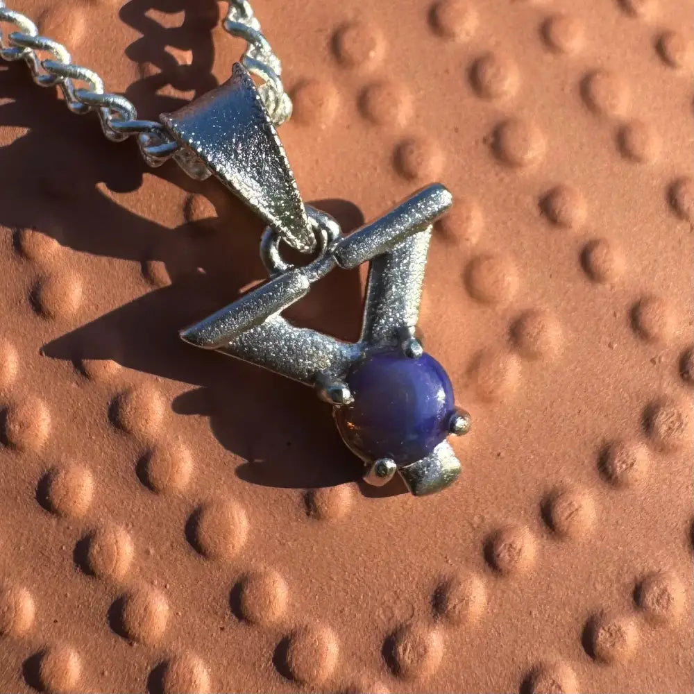 Silver pendant with a striking blue Lightning Ridge Opal in a handcrafted sterling silver necklace