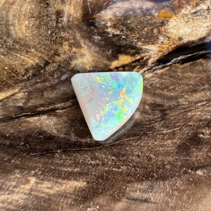 Iridescent triangular 1.0 carat Hand-Cut Solid Lightning Ridge Semi Black Opal gemstone
