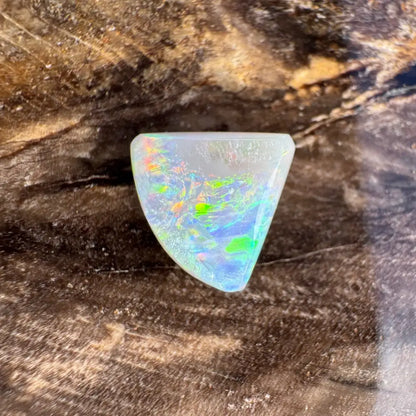 Iridescent triangular opal in 1.0 carat hand-cut solid Lightning Ridge semi black opal