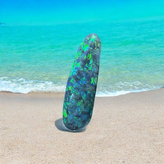 Iridescent black opal in 1.3ct hand-cut solid Lightning Ridge semi black opal display
