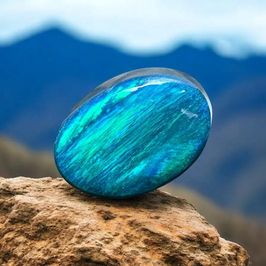 Iridescent blue-green gemstone in 1.4ct Hand-Cut Solid Lightning Ridge Semi Black Opal