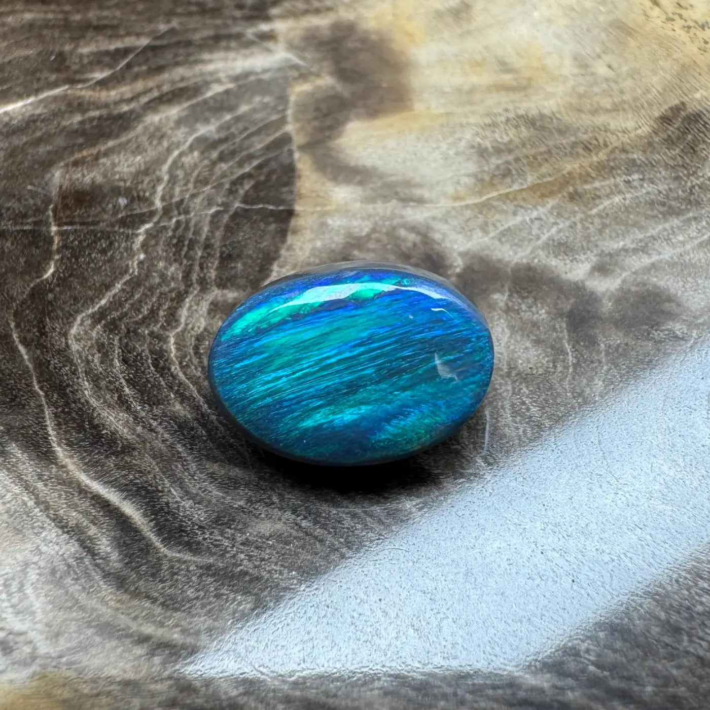 Iridescent blue-green opal cabochon from 1.4ct Hand-Cut Solid Lightning Ridge Semi Black Opal