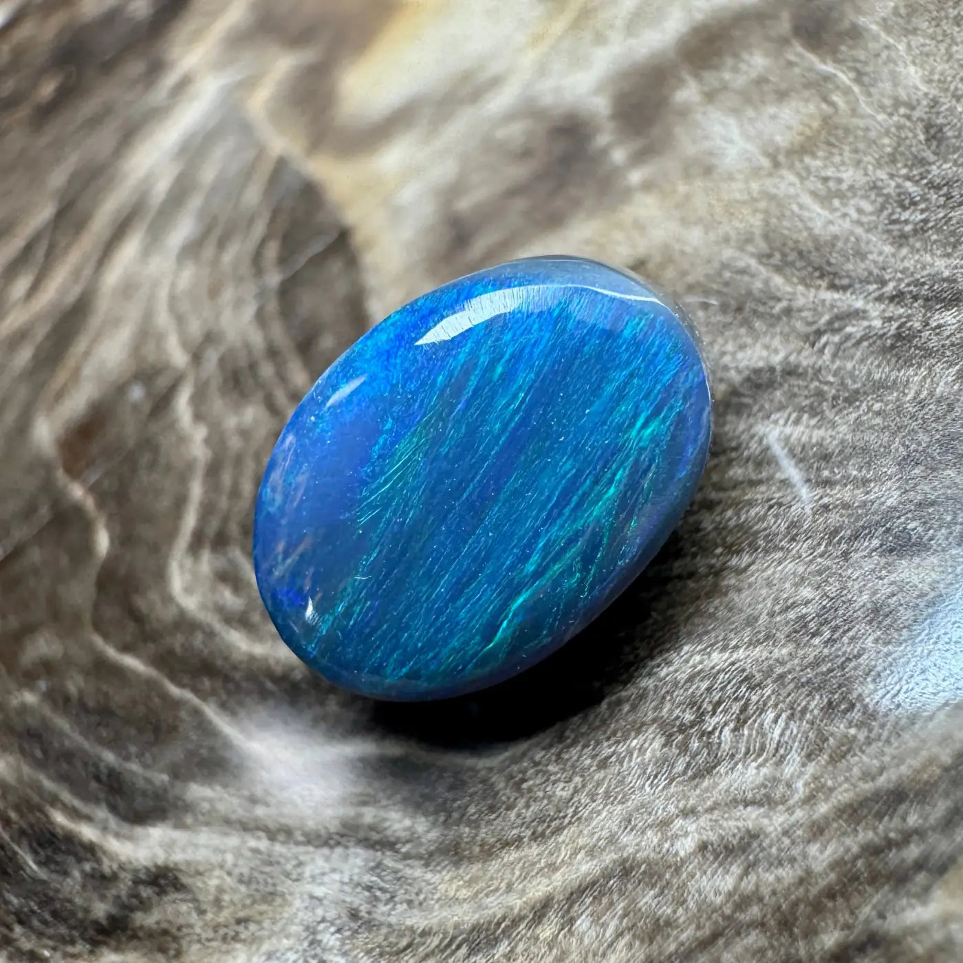 Iridescent blue opal cabochon from 1.4ct Hand-Cut Solid Lightning Ridge Semi Black Opal