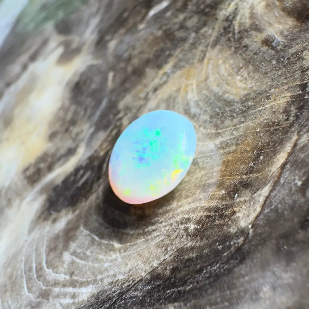 Oval opal with iridescent colors.