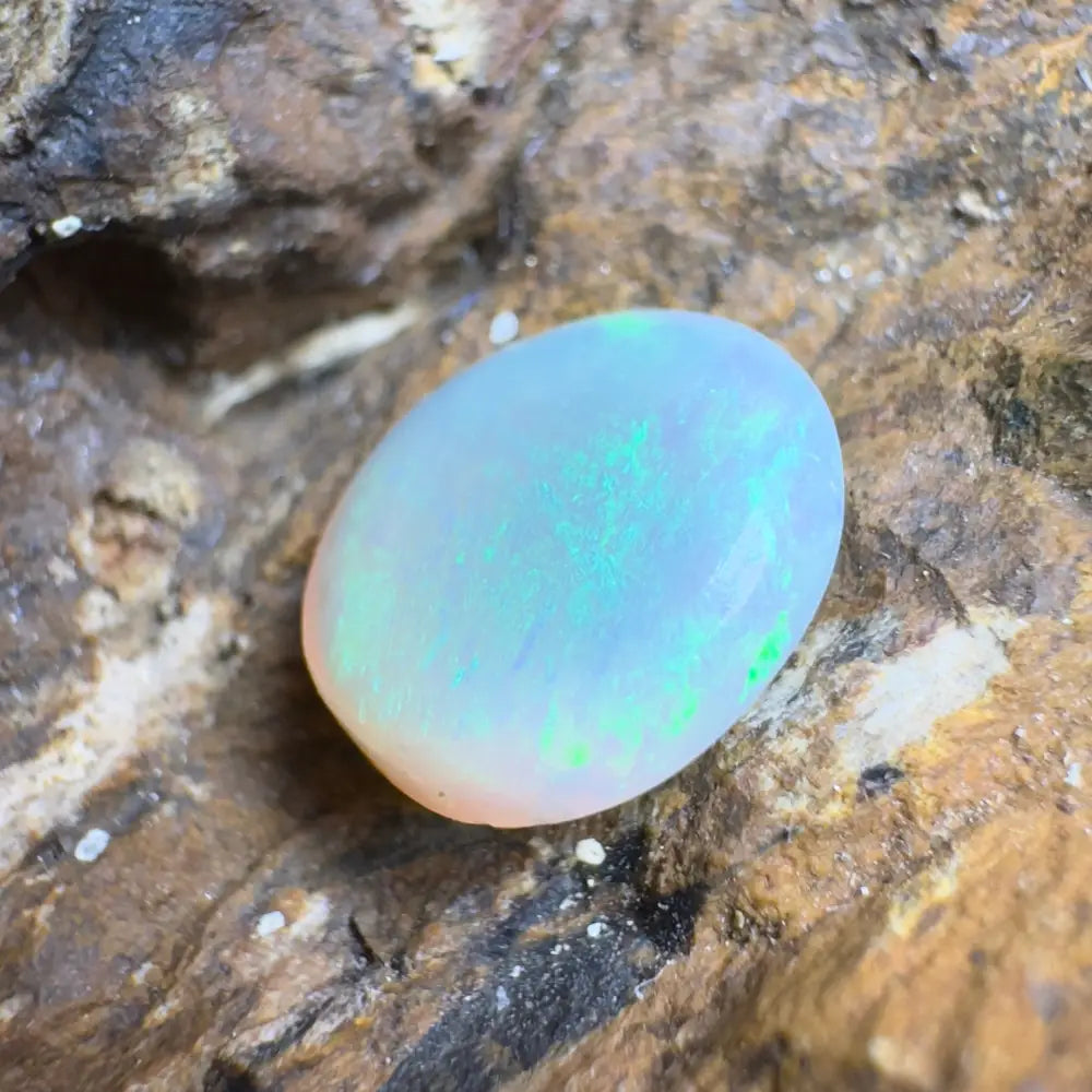 Oval opal with iridescent play-of-color.