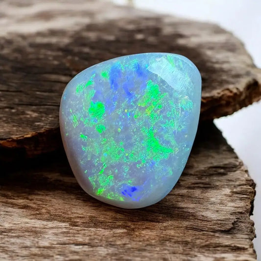 Iridescent Opal gemstone from Lightning Ridge in a 1.6ct hand-cut solid setting