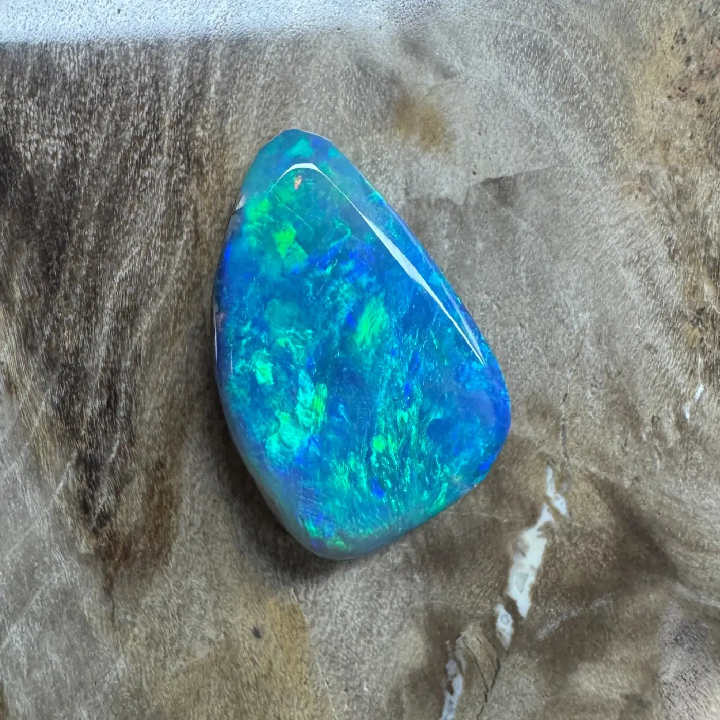Iridescent Blue-Green Opal Gemstone from Lightning Ridge in a 1.8ct Hand-Cut Semi Black Opal