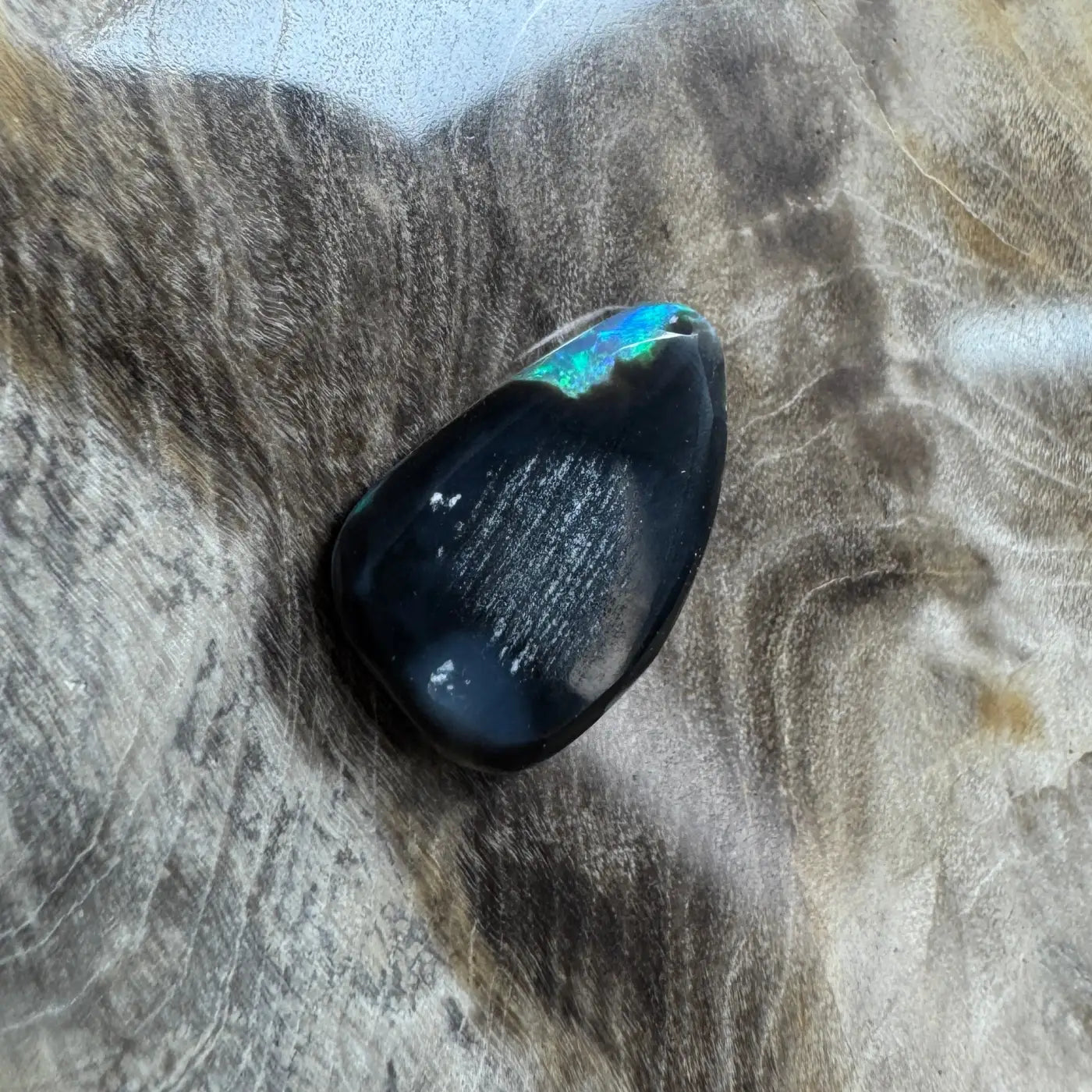 Polished 1.8ct Hand-Cut Solid Lightning Ridge Semi Black Opal with iridescent flash