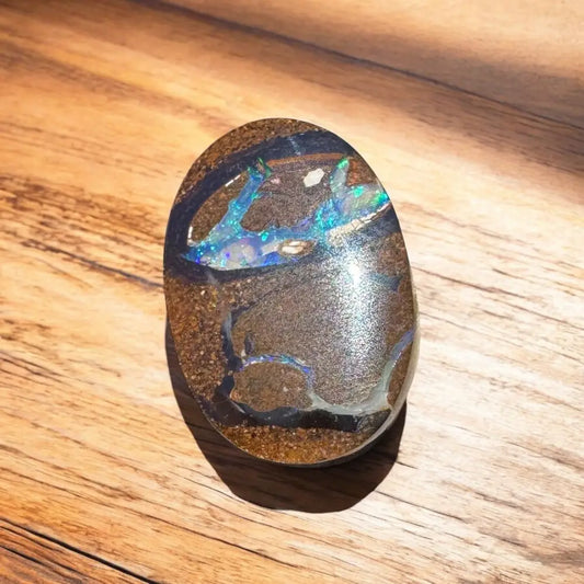Polished Boulder Opal with vibrant blue and green play-of-color in the 10.3ct Hand-cut Queensland Boulder Opal