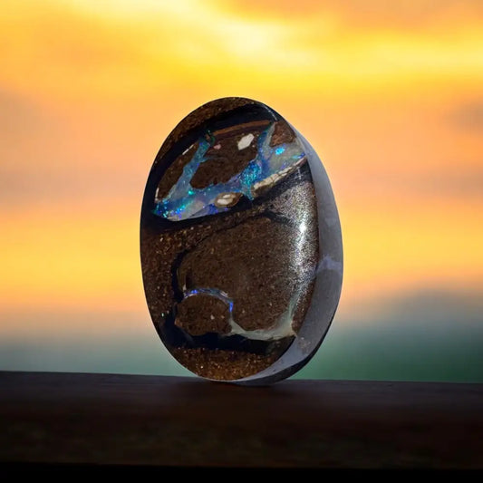 Polished black opal cabochon from 10.3ct Hand-cut Queensland Boulder Opal showcase