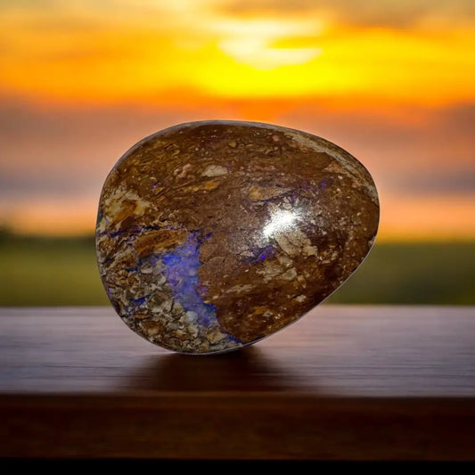 Polished brown boulder opal with vivid blue flash in the 11.3 carat Queensland handcrafted gemstone