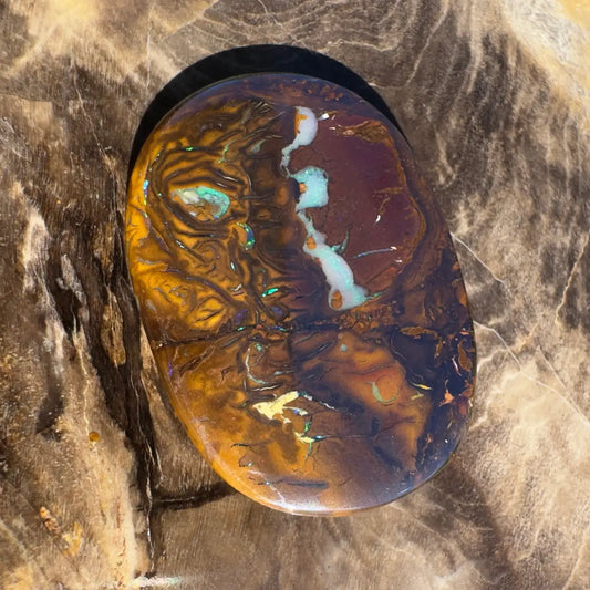 Polished Boulder Opal with vibrant color play from the 15.9 carat hand-cut solid Boulder Opal collection