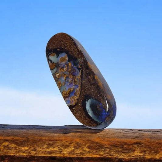 Polished 17.3ct Queensland Boulder Opal with vibrant blue and gold inclusions