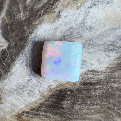 Square opal cabochon with colorful play-of-color.