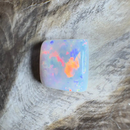 Square opal cabochon with vibrant color play.