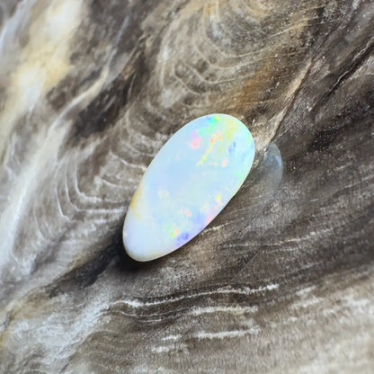 Iridescent, oblong opal.