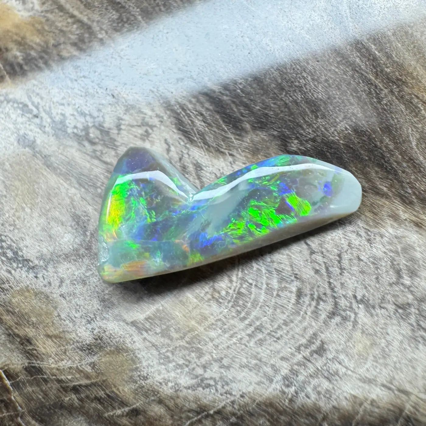 Iridescent opal gemstone from Lightning Ridge in the 2.5ct Hand-Cut Solid Semi Black Opal product
