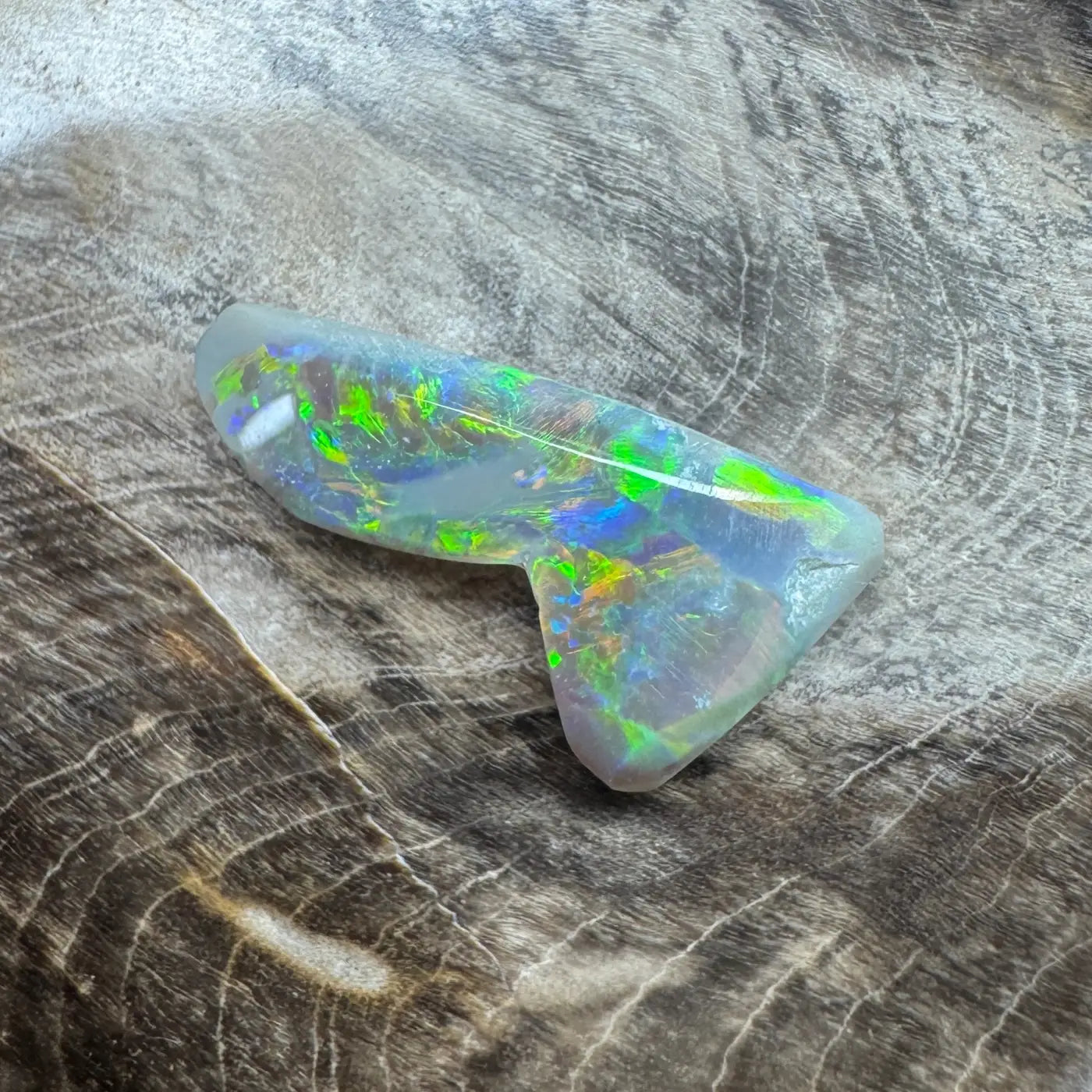 Iridescent Opal gemstone from Lightning Ridge in the 2.5ct Hand-Cut Solid Semi Black Opal product