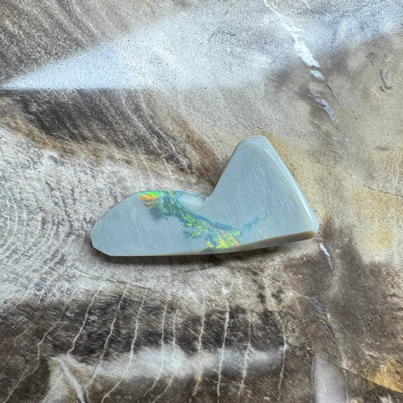 Iridescent mountain-shaped lightning ridge semi black opal gemstone for jewelry craftsmanship