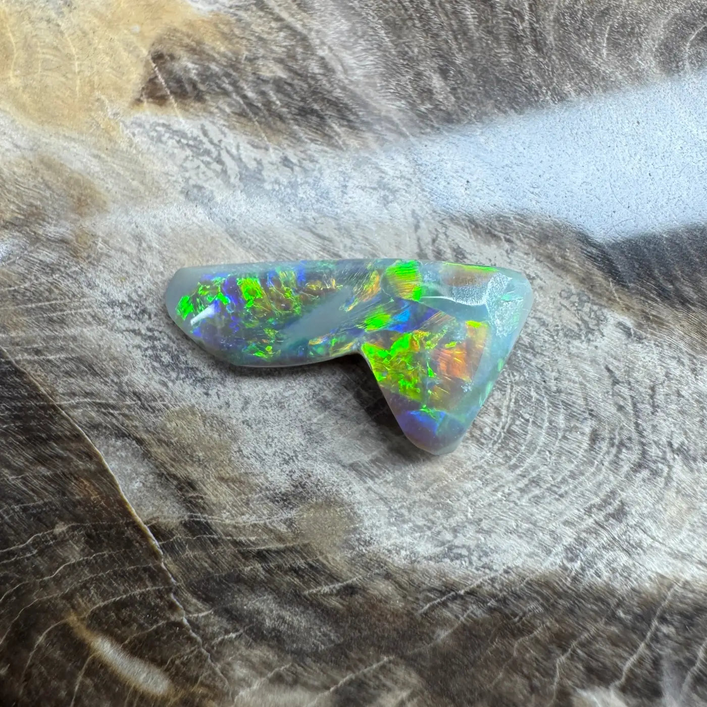 Iridescent opal gemstone from Lightning Ridge in the 2.5ct Hand-Cut Solid Semi Black Opal product