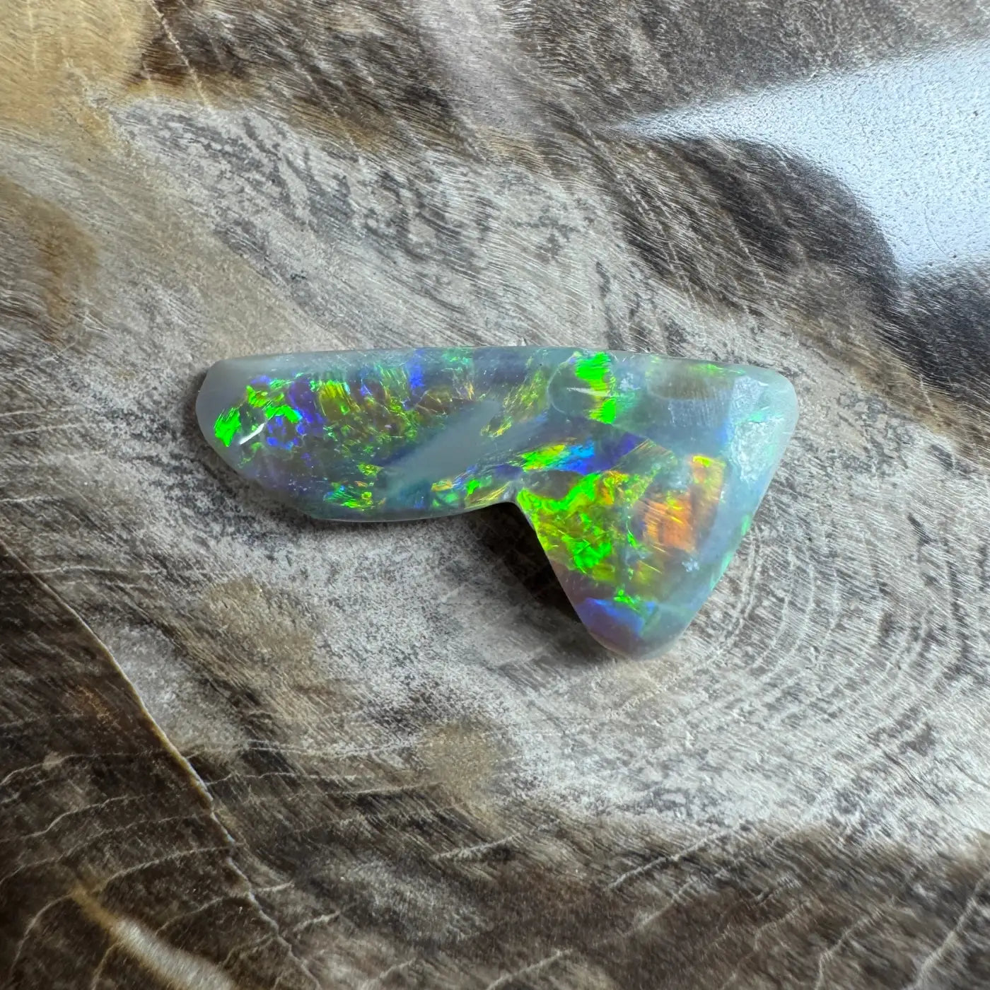 Iridescent Opal gemstone from Lightning Ridge in the 2.5ct Hand-Cut Solid Semi Black Opal product