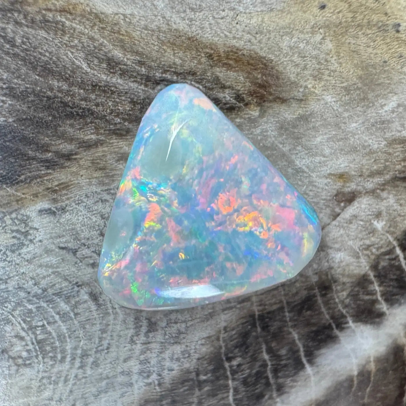 Iridescent triangular opal gemstone from 2.9ct Hand-Cut Solid Lightning Ridge Semi Black Opal