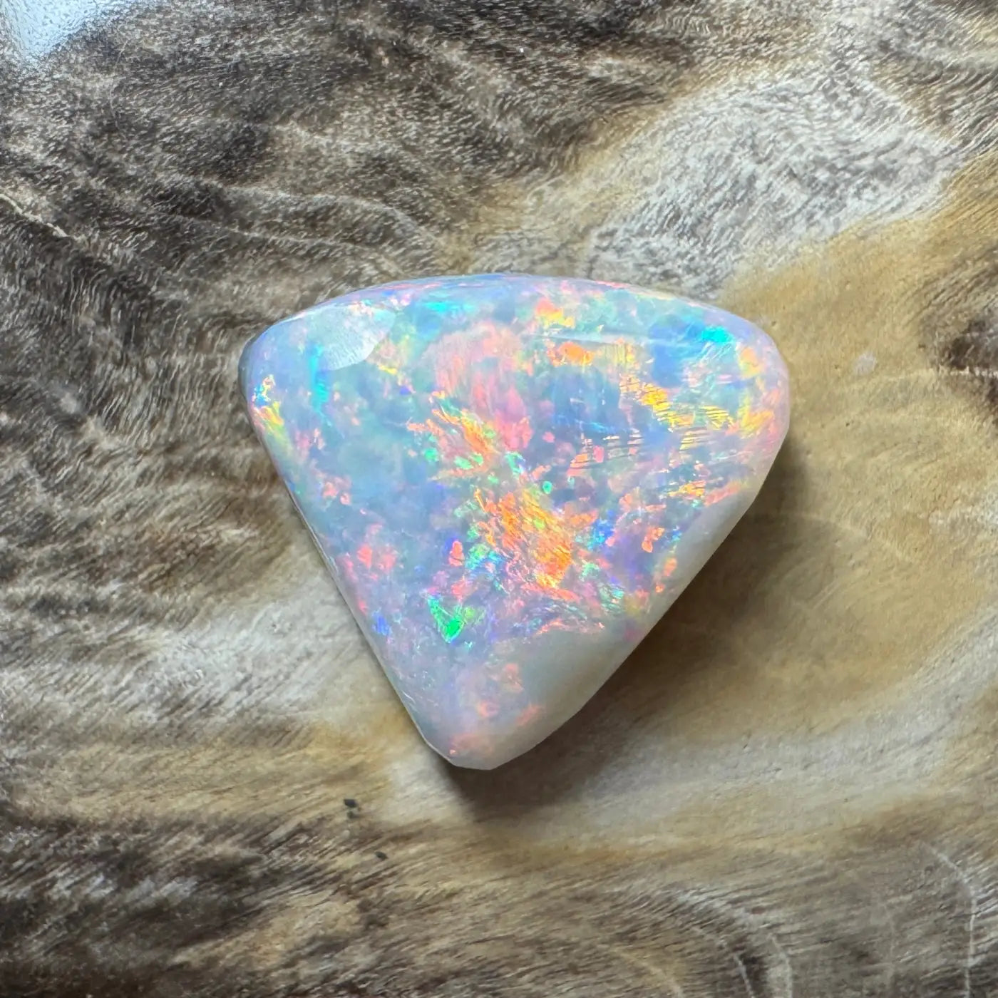 Iridescent Opal Gemstone from Lightning Ridge in a 2.9 Carat Hand-Cut Solid Semi-Black Opal product