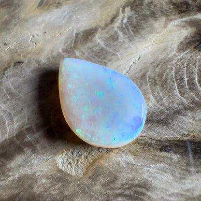 Iridescent teardrop-shaped opal.