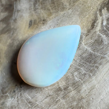 Iridescent, teardrop-shaped opal.