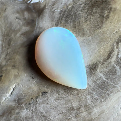 Iridescent, teardrop-shaped opal.