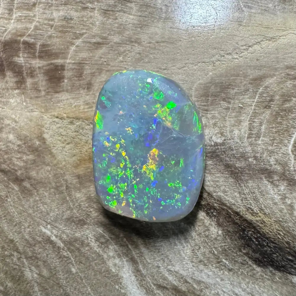 Iridescent opal gemstone from Lightning Ridge in the 3.2carat hand-cut solid semi-black opal product