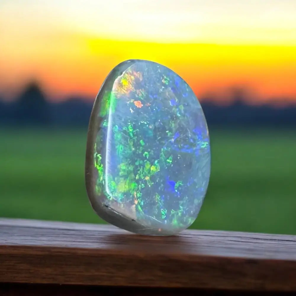 Iridescent opal gemstone from Lightning Ridge in a 3.2-carat hand-cut semi-black Opal piece