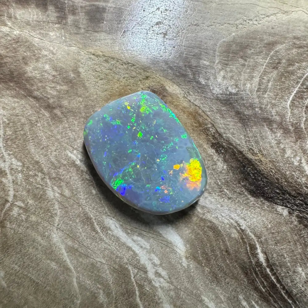 Iridescent opal gemstone in 3.2 carat hand-cut Lightning Ridge semi-black opal jewelry