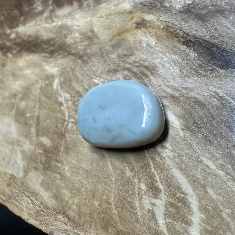 Smooth light blue polished stone from 3.2carat Hand-Cut Solid Lightning Ridge Semi Black Opal
