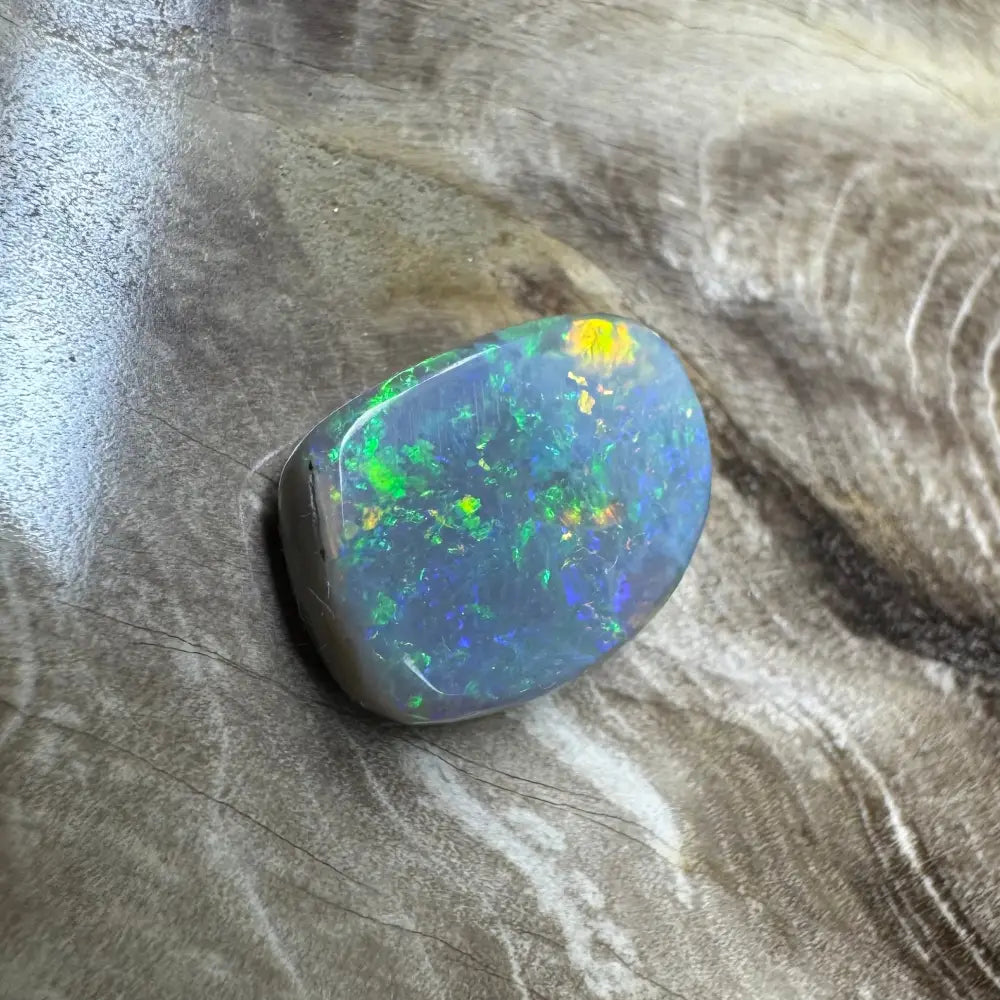 Polished Lightning Ridge semi black opal with vibrant color play and hand-cut craftsmanship