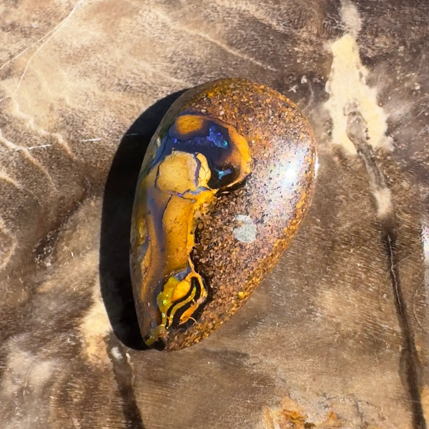 Polished Boulder Opal gemstone displayed in a 3.5ct hand-cut solid boulder opal product