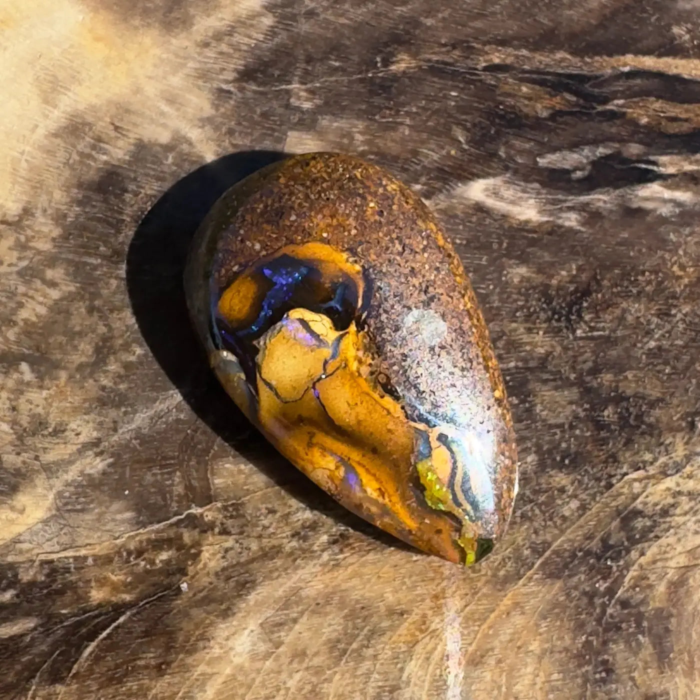 Polished Boulder Opal showcasing vibrant color play, part of the 3.5ct Hand-Cut Solid Boulder Opal product