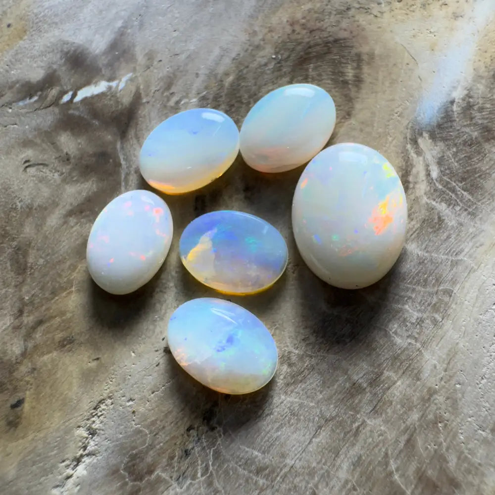Collection of iridescent opal gemstones.